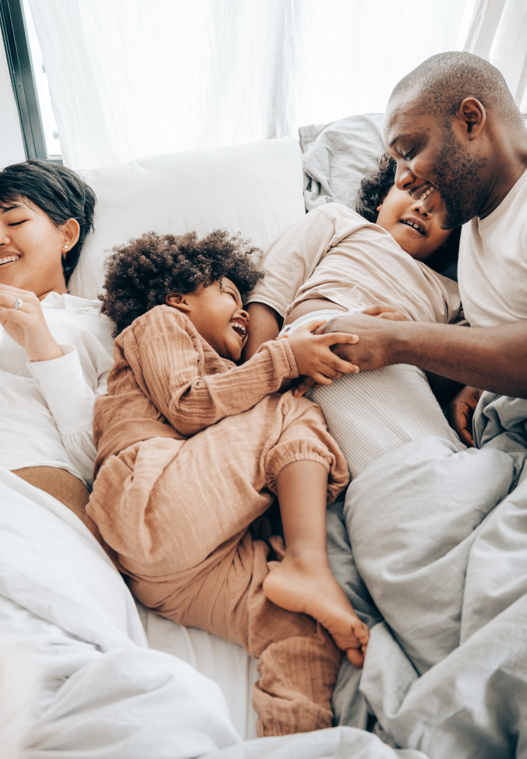 highly-sensitive-family-in-bed-cuddling